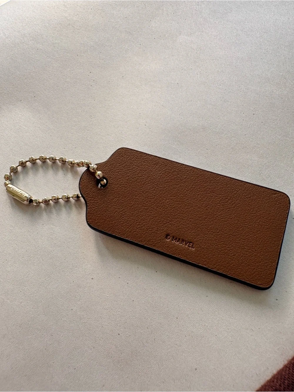 🦸♀️ Coach x MARVEL Ltd Ed Saddle Brown Leather HangTag Bag Charm | 2.375” - Picture 6 of 7